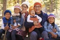 Portrait of Asian parents and four kids in a forest Royalty Free Stock Photo