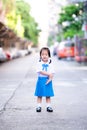 Portrait of Asian pupils girl wearing blue and white school uniform.