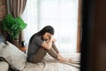 Sad teenager sitting on the bed Royalty Free Stock Photo