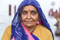 Portrait of Asian senior beautiful woman serious sad wearing traditional Indian dress sari.