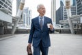 Portrait of Asian senior mature middle aged businessman in modern city Royalty Free Stock Photo