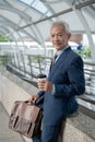 Portrait of Asian senior mature middle aged businessman in modern city Royalty Free Stock Photo