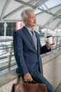 Portrait of Asian senior mature middle aged businessman in modern city Royalty Free Stock Photo