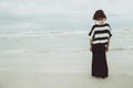 Portrait asian single tattoo hipster indy women lonely stand alone on the beach
