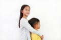 Portrait of Asian sister hugging her little brother on white background. Child girl cuddle her brother Royalty Free Stock Photo