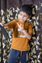 Portrait of Asian smart happy little boy using Mobile phone at home. Little boy holding mobile smart phone, online back to school Royalty Free Stock Photo