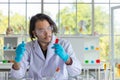 The Portrait of the Asian smart man scientist is holding two test tubes. In research laboratory Royalty Free Stock Photo