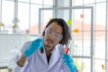 The Portrait of the Asian smart man scientist is holding two test tubes. In research laboratory Royalty Free Stock Photo