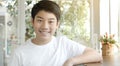 Portrait of asian smiling teen boy. Medium shot of handsome guy Royalty Free Stock Photo