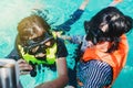 Portrait of an asian snorkeling girl with mask swiming on the se Royalty Free Stock Photo