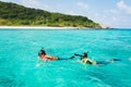 Asian snorkeling girls with mask swiming on the sea Royalty Free Stock Photo