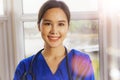 The portrait of an Asian surgeon smiling at the camera is friendly to everyone. Royalty Free Stock Photo