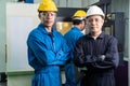 Portrait of Asian team maintenance engineer workers working machines in the factory.