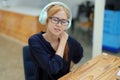 Portrait of an Asian teenage girl feeling pain in the neck muscles after working on a laptop computer for a long time Royalty Free Stock Photo