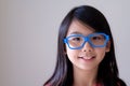 Portrait of Asian teenager with big blue glasses Royalty Free Stock Photo