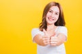 Woman smile wear white t-shirt successful woman giving two thumbs up gesture Royalty Free Stock Photo