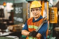 Portrait of Asian Thai Chinese labor happy worker enjoy happy smiling to work in a heavy industrial factory to fix machine with Royalty Free Stock Photo