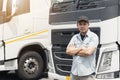 Portrait of Asian truck driver standing cross oneÃ¢â¬â¢s arm looking with smile. Royalty Free Stock Photo