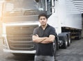 Portrait of Asian A Truck Driver Standing Cross One`s Arm with Semi Trailer Truck.