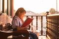 Portrait of asian uniform little child student reading and smiling with happy at home Royalty Free Stock Photo