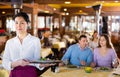 Portrait of asian waitress standing in restaurant Royalty Free Stock Photo