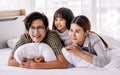 Portrait Asian warm family, father, mother, daughter playing together in weekend on white bed in cozy bedroom at home with love Royalty Free Stock Photo