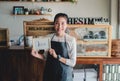 Portrait Asian woman business owner with bakery shop background