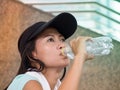 Portrait of asian woman drinks water thirstily Royalty Free Stock Photo