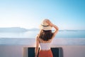 Portrait of an Asian woman looks out over the Aegean Sea by the sea, Santorini, Greece Royalty Free Stock Photo