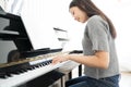 Portrait Asian woman playing  playing piano. Royalty Free Stock Photo