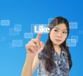 Portrait of asian woman pressing like button Royalty Free Stock Photo