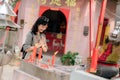 Portrait of asian woman saying prayers and eyes close in front of local Chinese shrine in Bangkok, Thailand