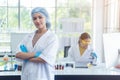 Portrait, asian woman scientist chemistry experiments in lab room, Teamwork scientific research. Royalty Free Stock Photo