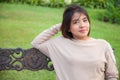 Portrait Asian woman sitting on the bench. Royalty Free Stock Photo