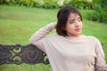 Portrait Asian woman sitting on the bench. Royalty Free Stock Photo
