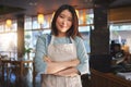 Portrait, asian woman and small business entrepreneur of restaurant with arms crossed for professional service Royalty Free Stock Photo