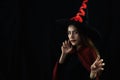 Portrait of asian woman in spooky costume of witch for halloween party celebration