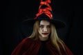 Portrait of asian woman in spooky costume of witch for halloween party celebration