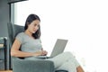 Portrait asian woman using laptop computer working on the table at home. People during the introvert time at home from the