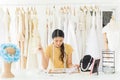 Portrait of asian woman wedding dress store owner,Beautiful female dressmaker in shop and small business Royalty Free Stock Photo