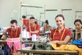 Asian workers in garment factory sewing with industrial sewing m Royalty Free Stock Photo