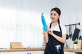 Portrait of Asian young cleaning service woman worker working in house. Beautiful woman housewife housekeeper cleaner wearing Royalty Free Stock Photo