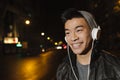 Portrait of a asian young man listening music. Royalty Free Stock Photo