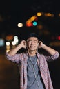 Portrait of a asian young man listening music. Royalty Free Stock Photo