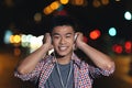 Portrait of a asian young man listening music. Royalty Free Stock Photo