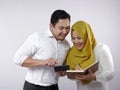 Muslim Couple Analyzing Financial Management Report Royalty Free Stock Photo