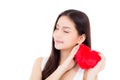 Portrait of asian young woman holding heart shape pillowand smile Royalty Free Stock Photo