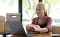 Portrait of Asian young woman SME working with a box at home the workplace.start-up small business owner, small business Royalty Free Stock Photo