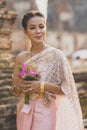 Portrait of asian younger woman wearing thai tradition clothes h Royalty Free Stock Photo