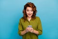 Portrait of astonished crazy addicted social media user woman read incredible blogging post on her smartphone impressed Royalty Free Stock Photo